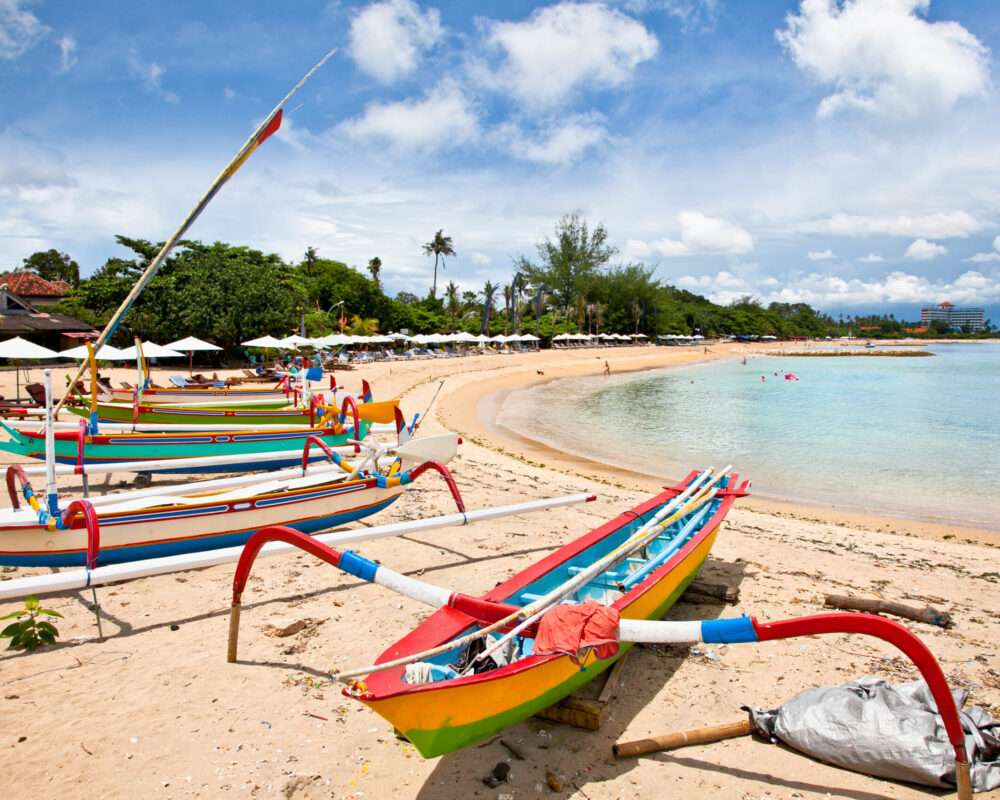 Traditional fishing boats on a beach in Sanur on Bali Traditional fishing boats on a beach in Sanur on Bali. Indonesia.